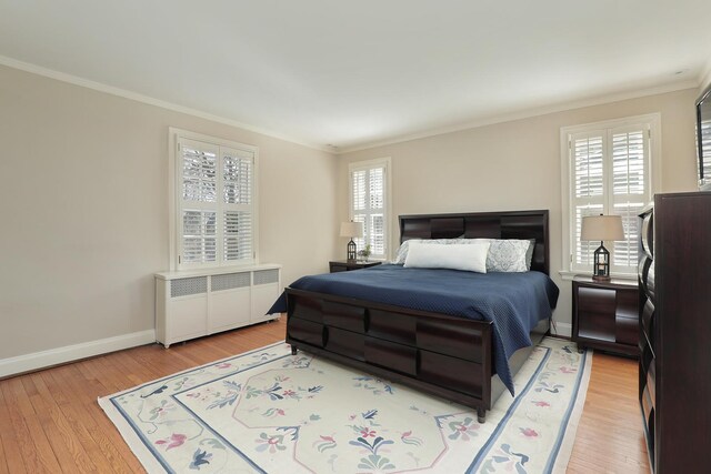 2252 Orrington Ave, Evanston, IL 60201 - bedroom with crown molding, radiator, baseboards, and light wood-type flooring