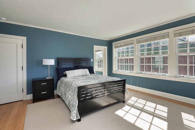 2252 Orrington Ave, Evanston, IL 60201 - bedroom featuring wood finished floors, baseboards, and ornamental molding