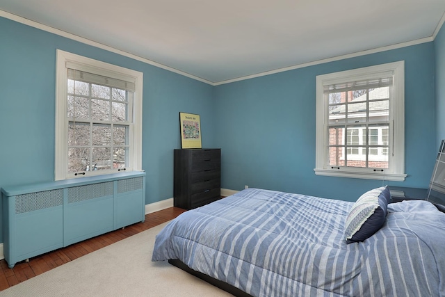 2252 Orrington Ave, Evanston, IL 60201 - bedroom with crown molding, baseboards, and wood finished floors