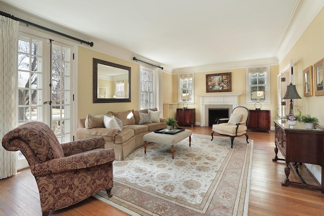 2252 Orrington Ave, Evanston, IL 60201 - living area featuring ornamental molding, a fireplace, and wood finished floors