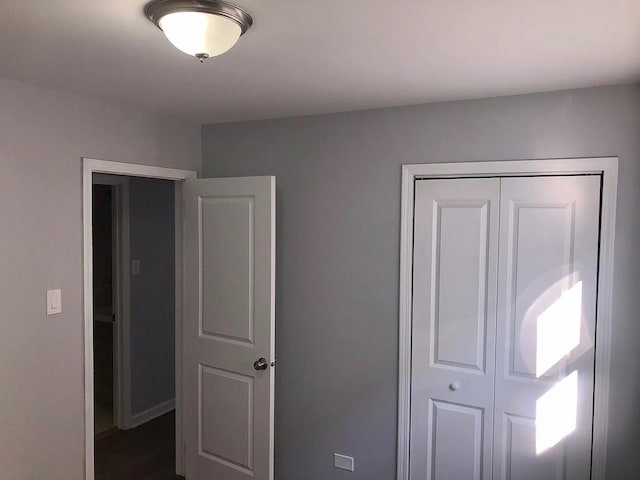 unfurnished bedroom with a closet