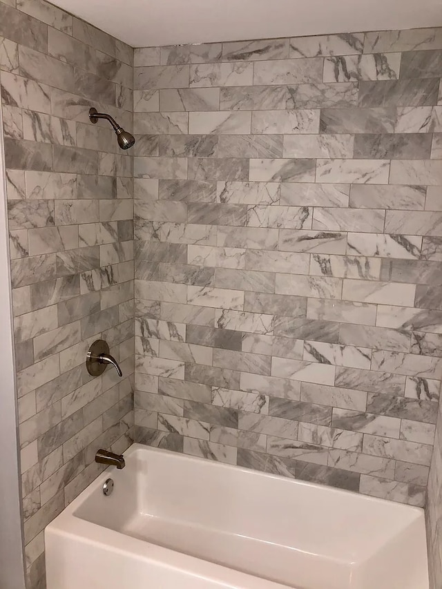 full bath featuring shower / washtub combination