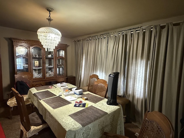 dining area with an inviting chandelier