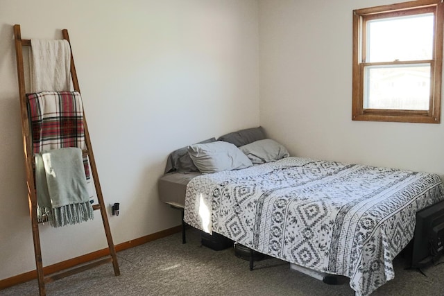 bedroom with carpet flooring and baseboards