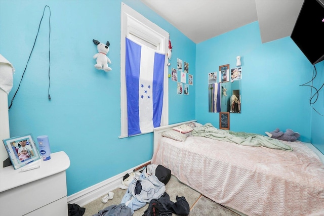 bedroom featuring baseboards