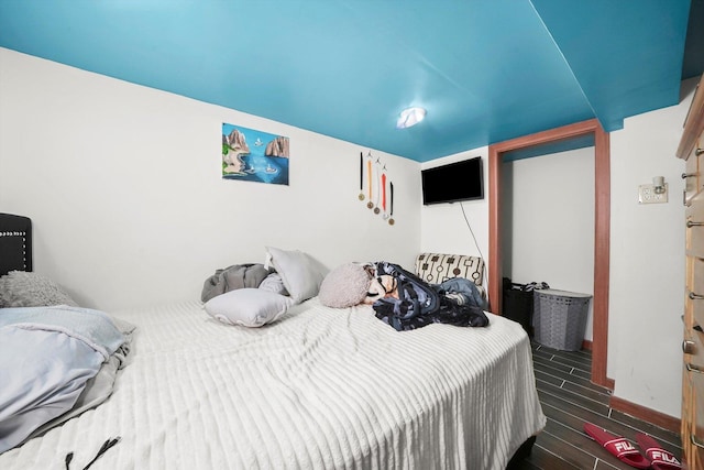 bedroom featuring wood finish floors