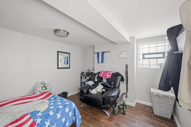 bedroom with wood finish floors and baseboards
