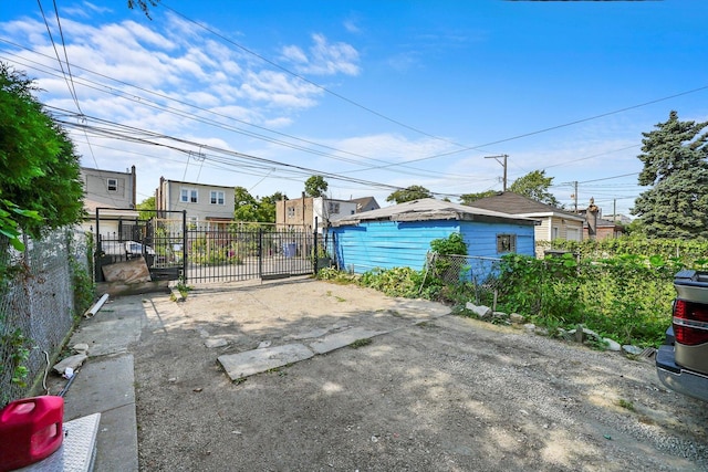 exterior space featuring fence and a gate
