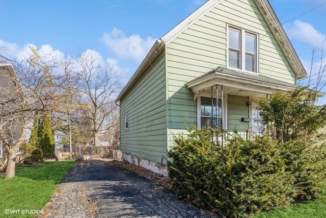 view of property exterior with a porch