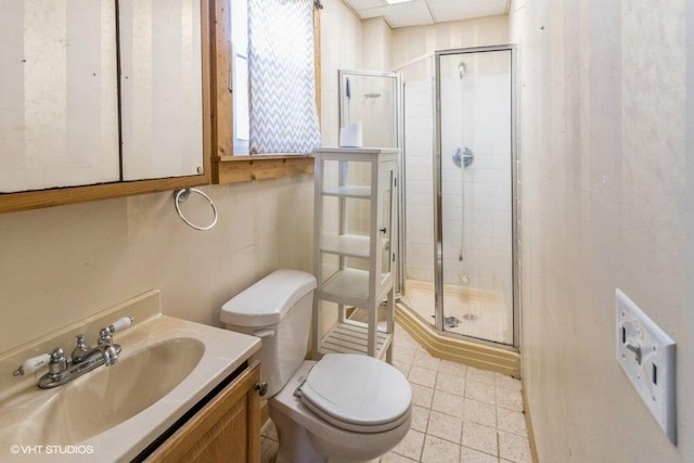 full bath with a shower stall, toilet, and vanity