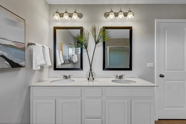 full bathroom featuring a sink and double vanity