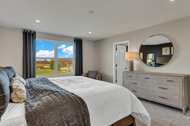 carpeted bedroom with recessed lighting