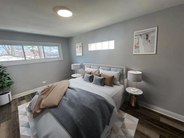 bedroom featuring dark wood-style floors and baseboards