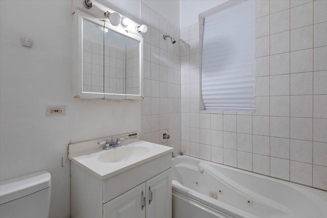 full bath featuring vanity, a combined bath / shower with jetted tub, and toilet