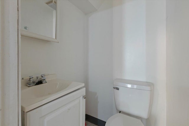 bathroom with toilet and vanity