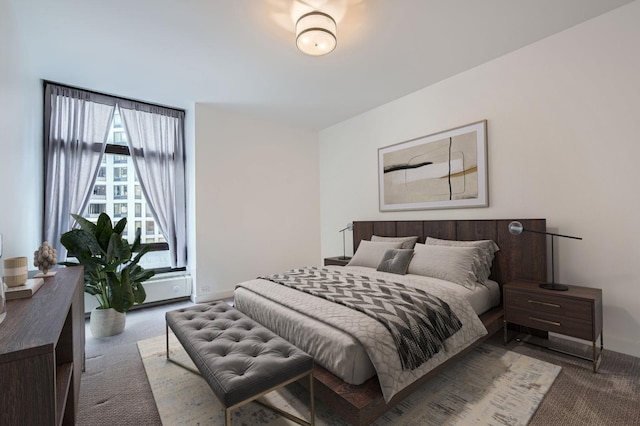 carpeted bedroom featuring baseboards