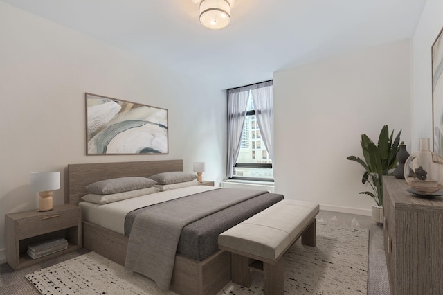 bedroom featuring light carpet and baseboards