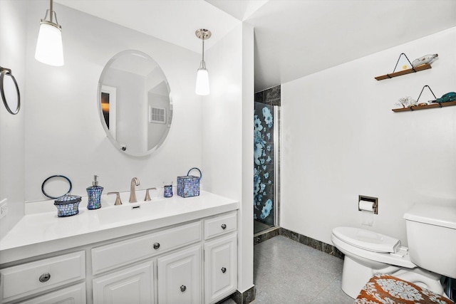 full bath featuring toilet, a shower stall, baseboards, and vanity