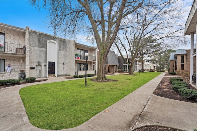 view of community with a residential view and a lawn