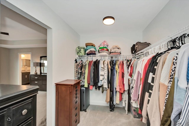 spacious closet with light carpet and visible vents