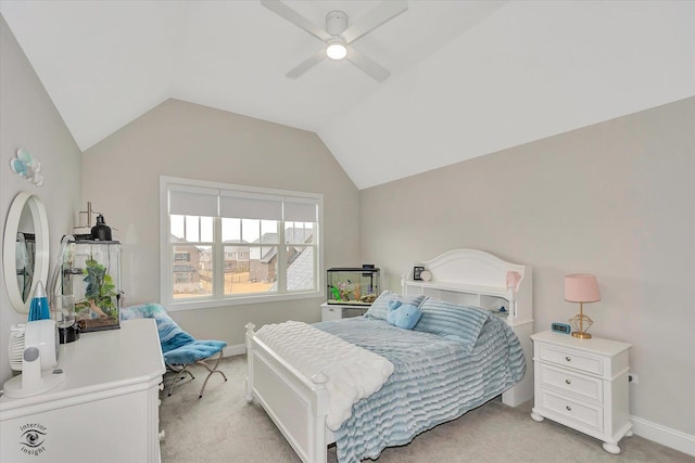 bedroom with a ceiling fan, lofted ceiling, light carpet, and baseboards