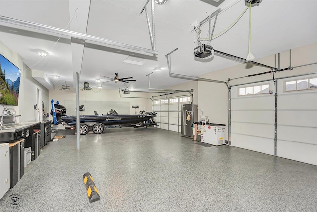 garage featuring water heater and a garage door opener