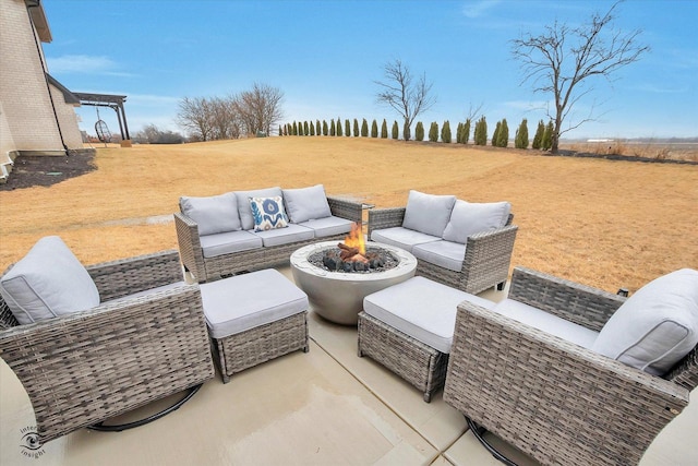 view of patio / terrace featuring an outdoor living space with a fire pit