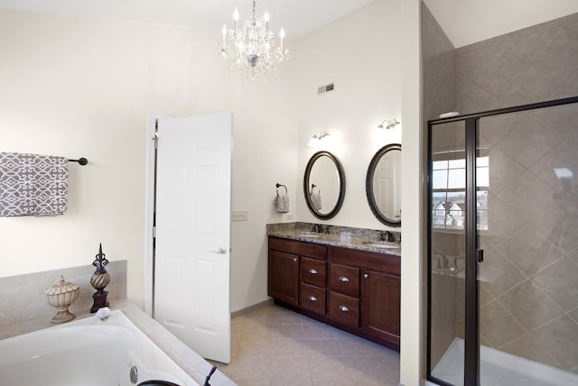 full bathroom featuring a stall shower, tile patterned flooring, a sink, and visible vents