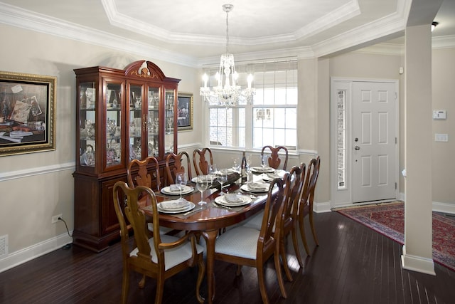 dining room featuring an inviting chandelier, baseboards, dark wood finished floors, and ornamental molding