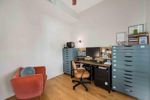 office area with light wood-type flooring and baseboards