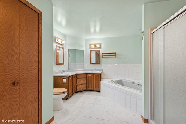 full bathroom with double vanity, a bath, marble finish floor, and a sink