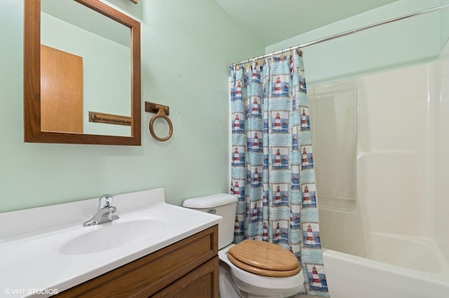 full bathroom featuring shower / tub combo with curtain, toilet, and vanity