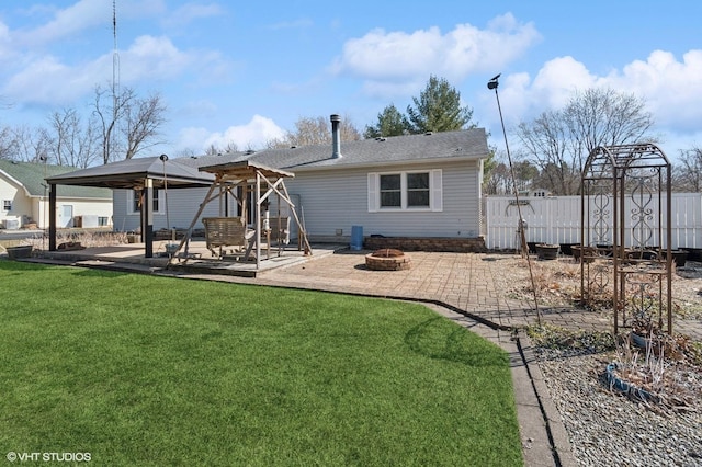 back of house with a patio, fence, a yard, a gazebo, and a fire pit