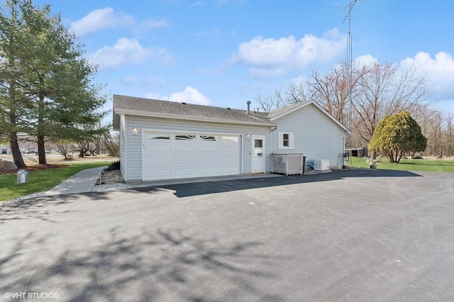 view of side of home featuring a garage