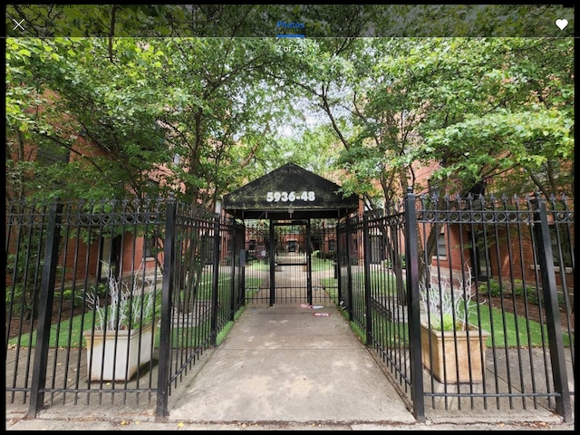 view of gate with fence