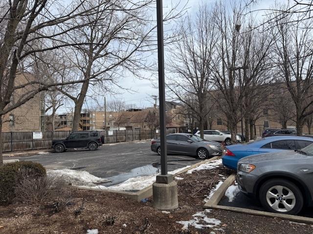 uncovered parking lot with fence