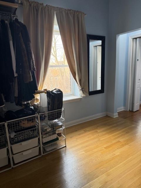 interior space with light wood-style floors and baseboards