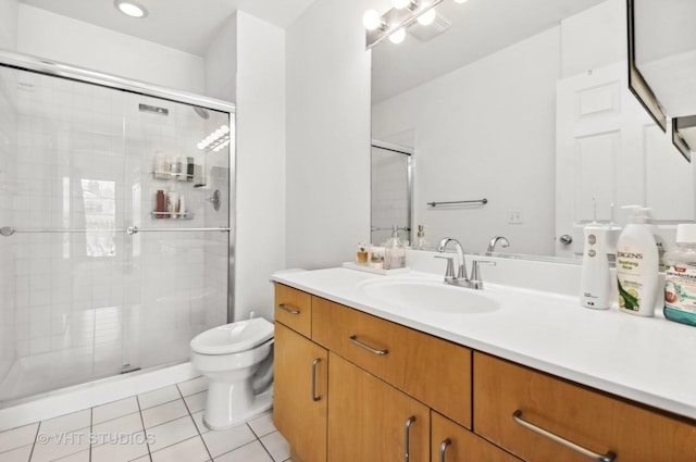 full bathroom with toilet, a stall shower, vanity, and tile patterned floors