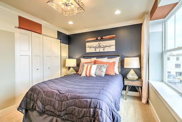 bedroom with recessed lighting, a closet, light carpet, and baseboards