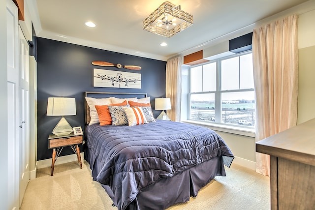 bedroom with light carpet, recessed lighting, and baseboards