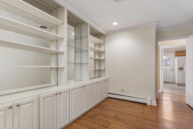 interior space with recessed lighting, a baseboard heating unit, ornamental molding, wood finished floors, and white fridge with ice dispenser