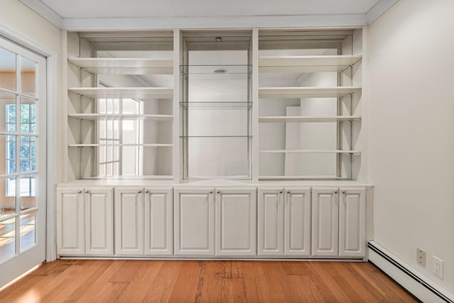 closet featuring baseboard heating