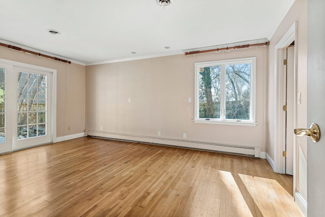 spare room featuring a baseboard radiator, visible vents, baseboards, light wood-style floors, and ornamental molding