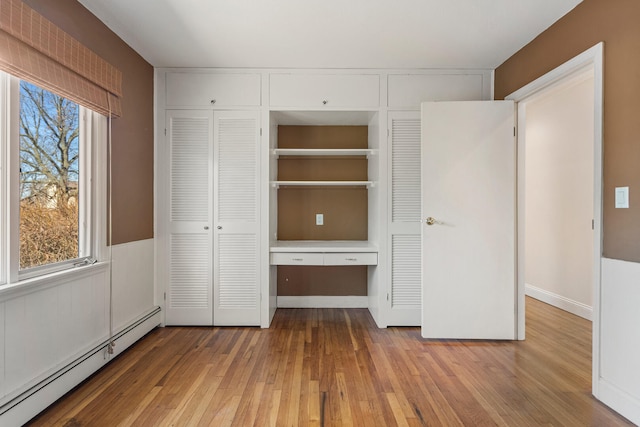 closet with a baseboard radiator