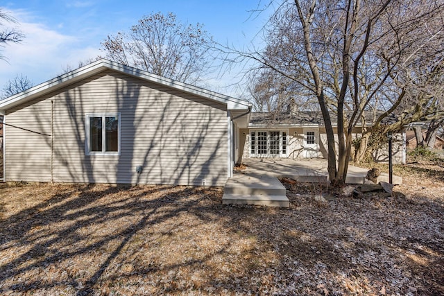 rear view of property featuring a patio area