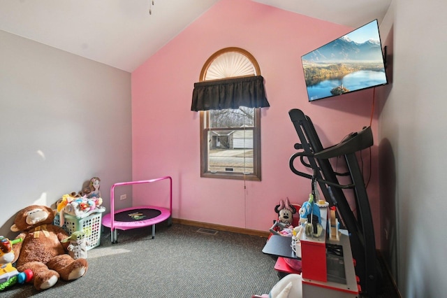 rec room with carpet, visible vents, and vaulted ceiling