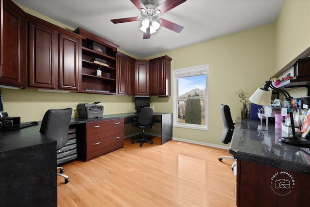 office space with ceiling fan, light wood-type flooring, and baseboards