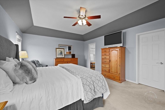 bedroom with a ceiling fan, light carpet, and baseboards