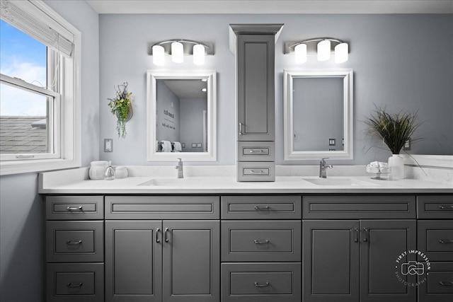 bathroom with double vanity and a sink