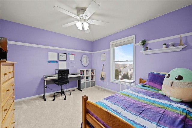 carpeted bedroom featuring ceiling fan and baseboards